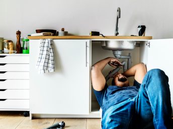 plumber-man-fixing-kitchen-sink